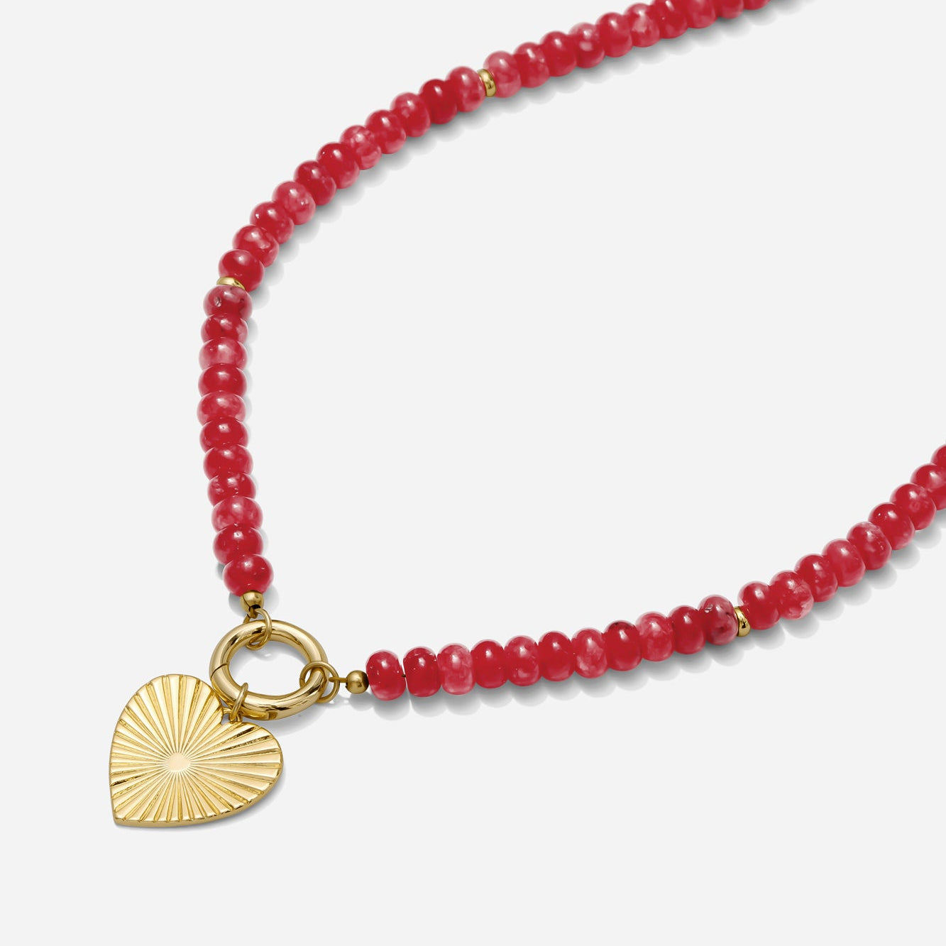 Red beaded necklace with a gold carabiner clasp and gold heart charm on a white background handmade by Katie Dean Jewelry