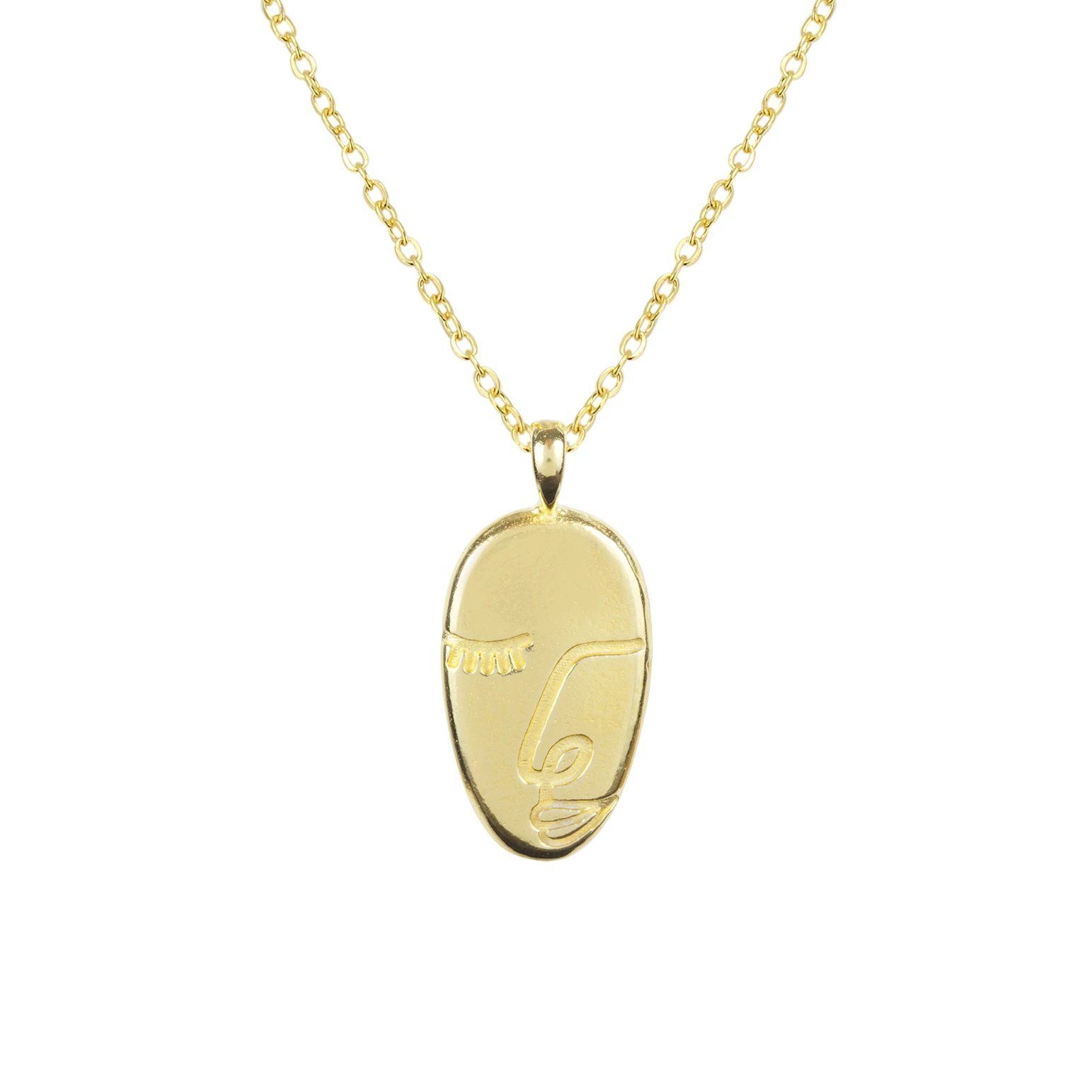 Gold and dainty Artist Face Necklace against a white background