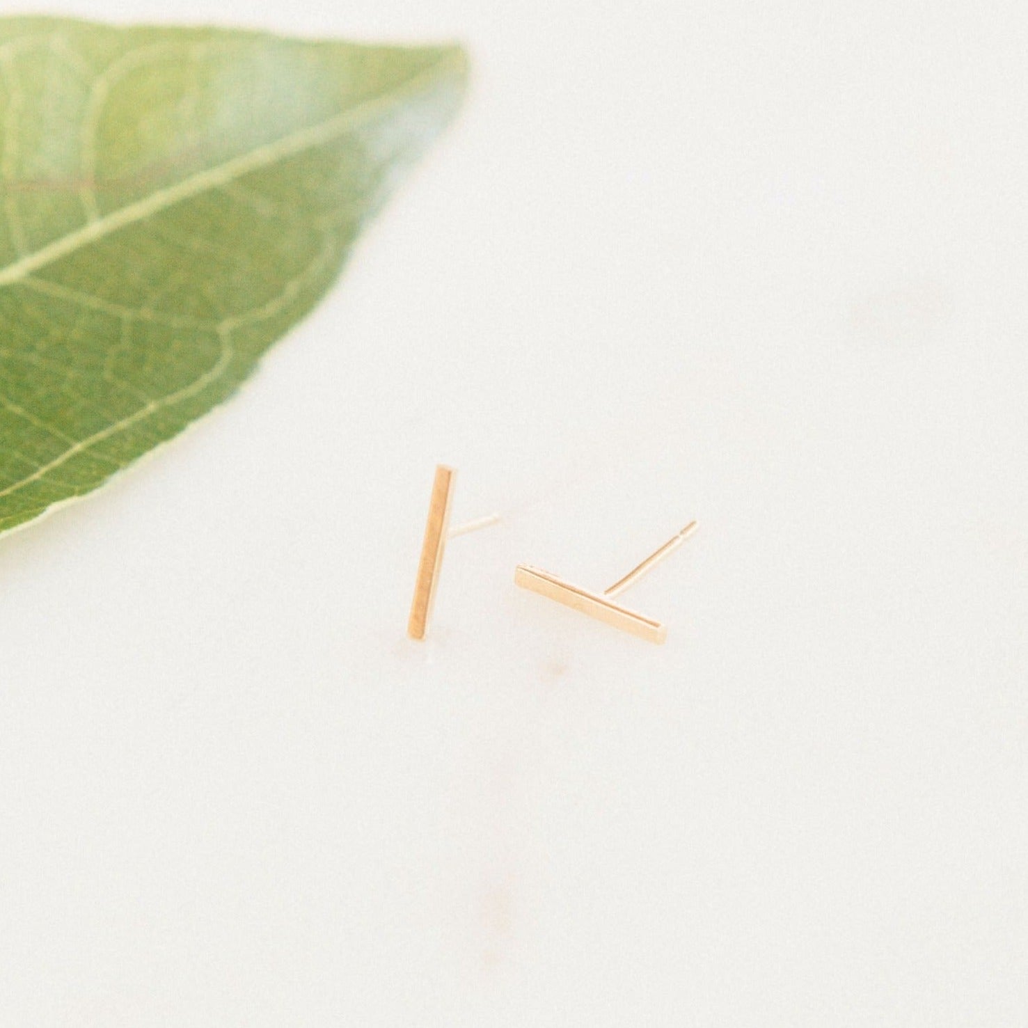 The Bar Studs. Made for the minimalist. Handmade in America by Katie Dean Jewelry. Solid 14k Yellow Gold. Nickel free and hypoallergenic.