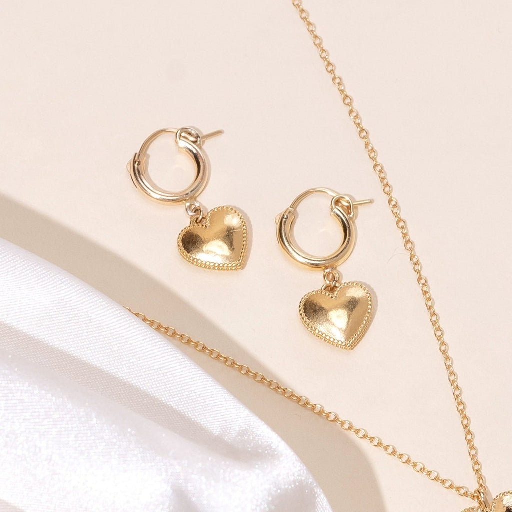 Dainty gold Heart Hoops handmade by Katie Dean Jewelry in America with a beaded edge.