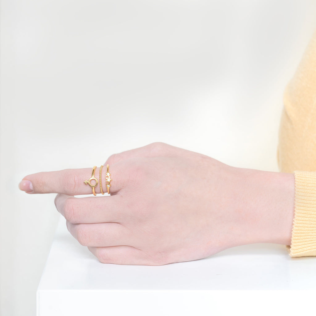 Wear your feminism loud and proud with the Feminist Stack. After all, women are pure magic. This stack includes: Starburst Ring, Beaded Ring, Female Symbol Ring. Handmade in California by Katie Dean Jewelry.