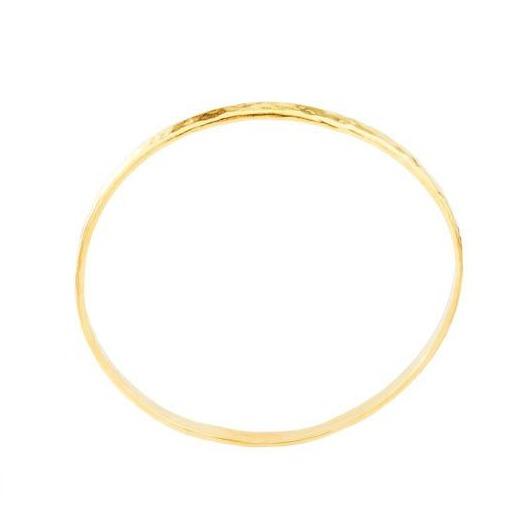 Up close image of the gold Hammered Bangle against a white background. 