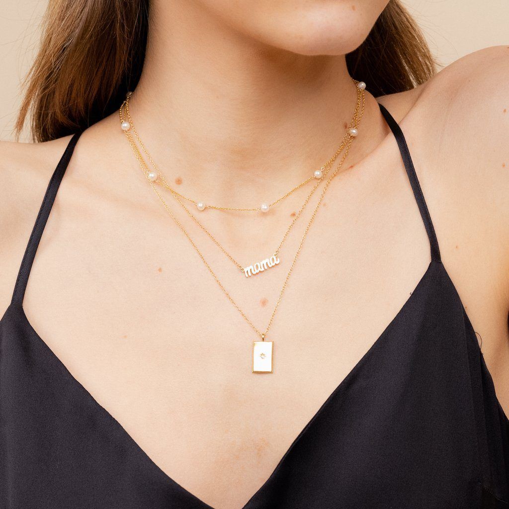 Dainty gold Mama Necklace layered with the Pearl Choker, and Rectangle Necklace by Katie Dean Jewelry