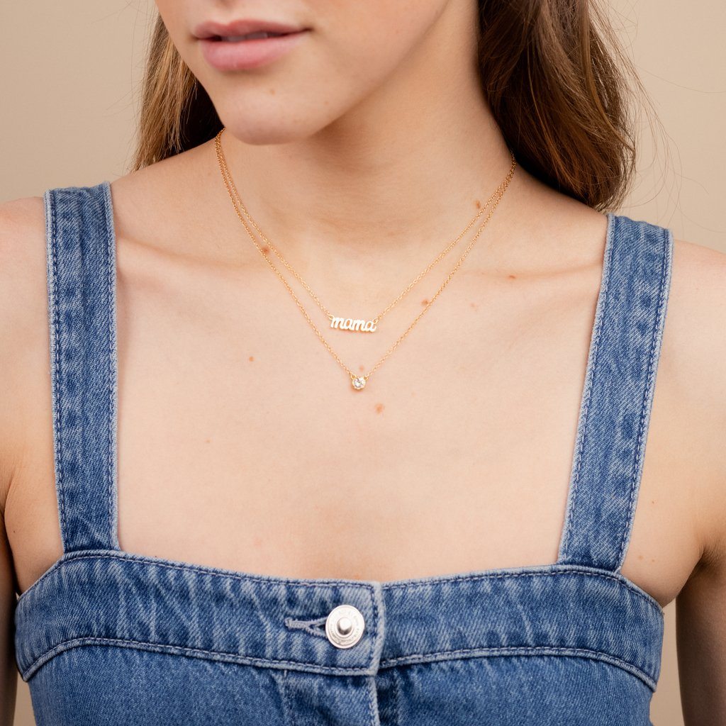 Dainty gold Mama Necklace layered with the April Birthstone Necklace by Katie Dean Jewelry