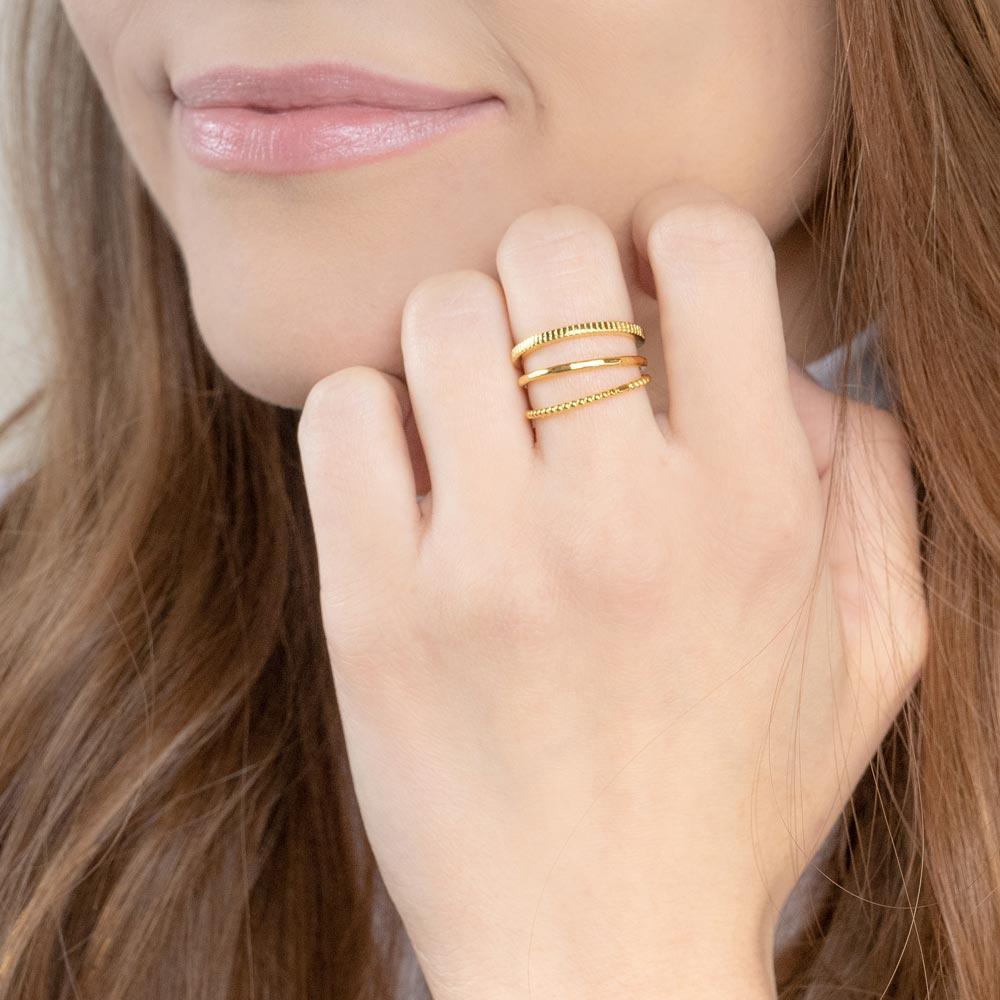 Up close image of model wearing the gold Minimal Stack.
