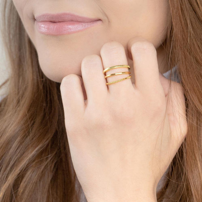 Up close image of model wearing the gold Minimal Stack.