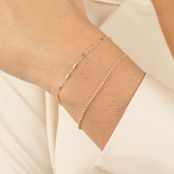 The Minimal Bracelet Set as shown on a hand model, handmade in California by Katie Dean Jewelry.