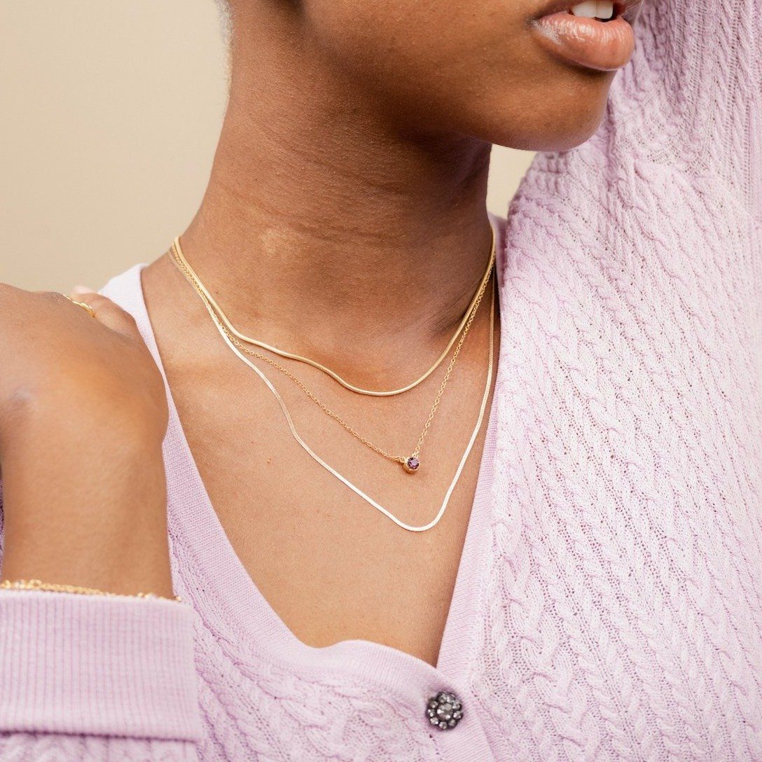 Gold Filled Herringbone Chain Necklace as seen on model layered with Snake Chain Necklace and Birthstone Necklace