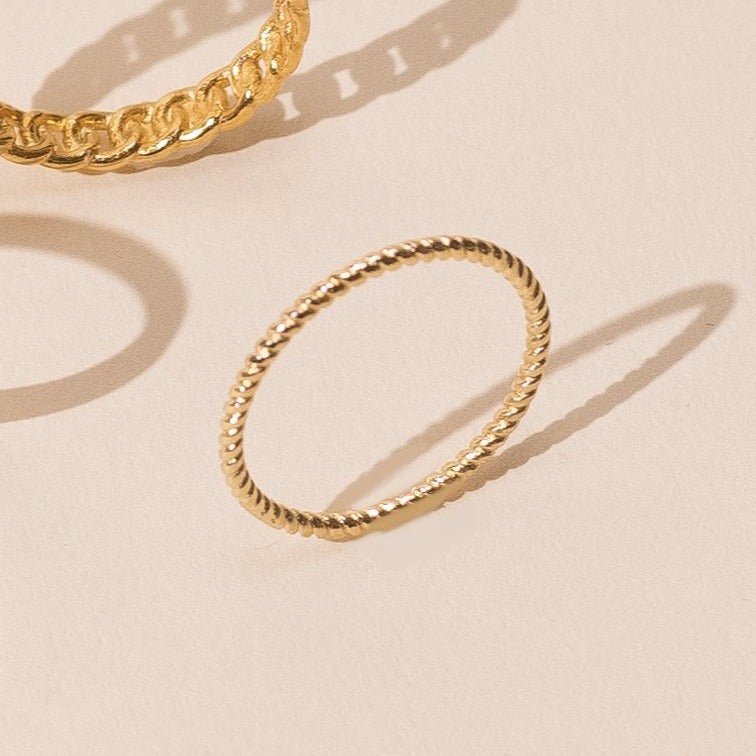 Dainty minimal Spiral Stacking Ring, handmade in America by Katie Dean Jewelry, gold plated over brass.