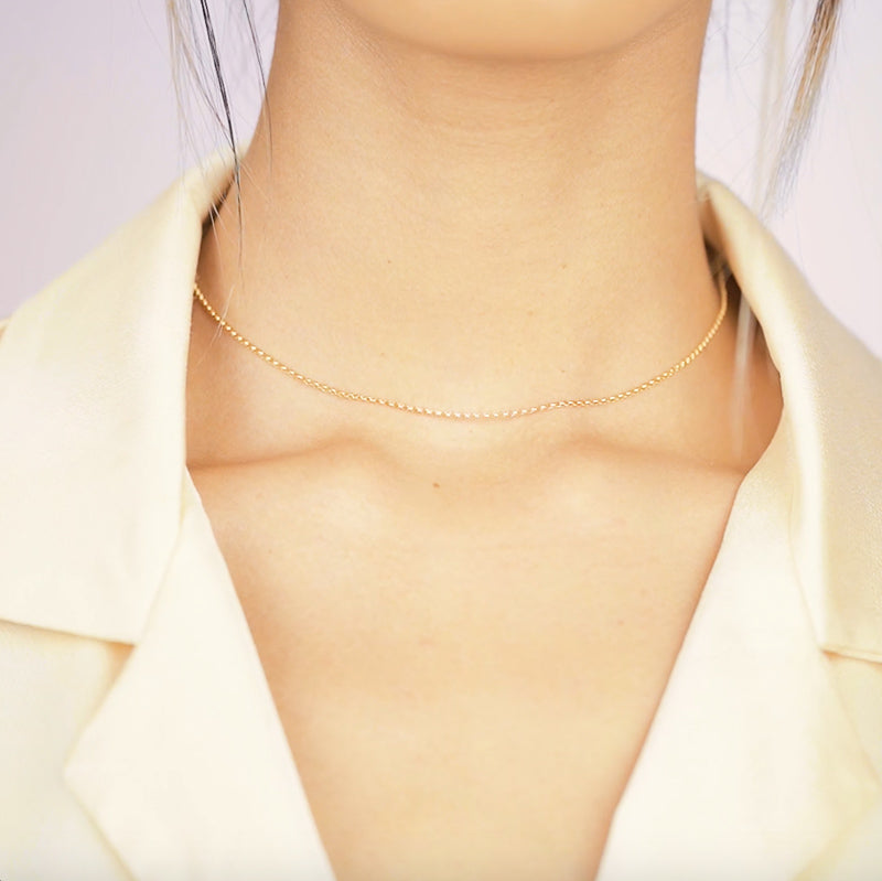The Gold Rolo Choker Necklace, to the point, but anything except boring. Truly for every type of woman and perfectly pairs with any jewelry! A basic everyone should own.  Handmade in California by Katie Dean Jewelry.